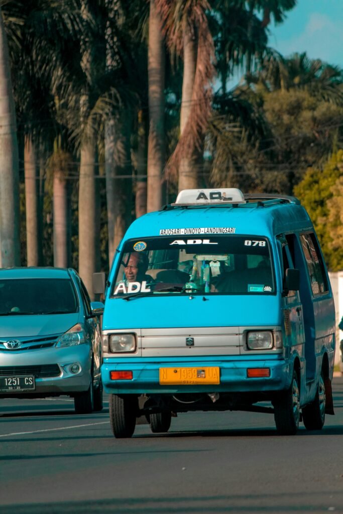 blue and white volkswagen van on road during daytime