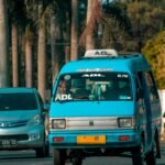 blue and white volkswagen van on road during daytime